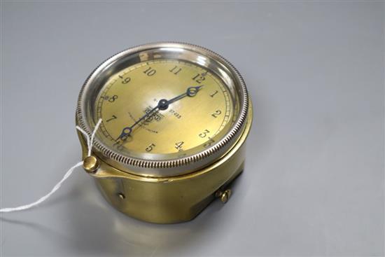 An early 20th century Smiths brass automobile timepiece, diameter 9cm